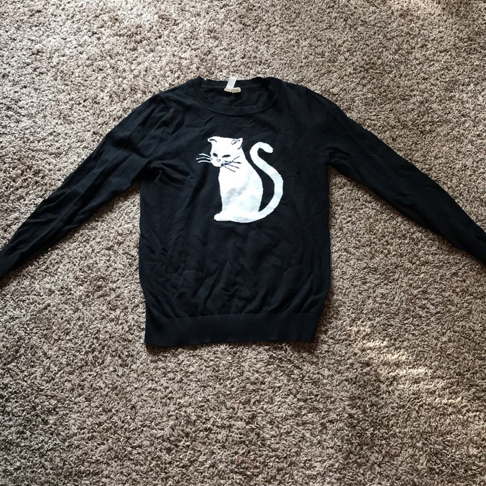 Black sweater with white cat